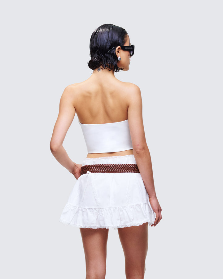 Women's white top close-up detail – FINESSE
